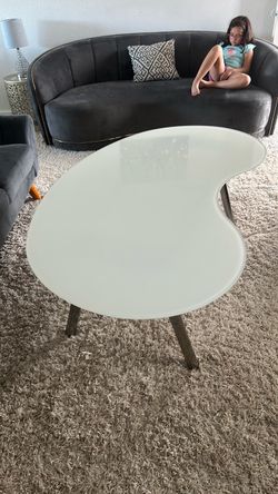 White glossy table with a glass top