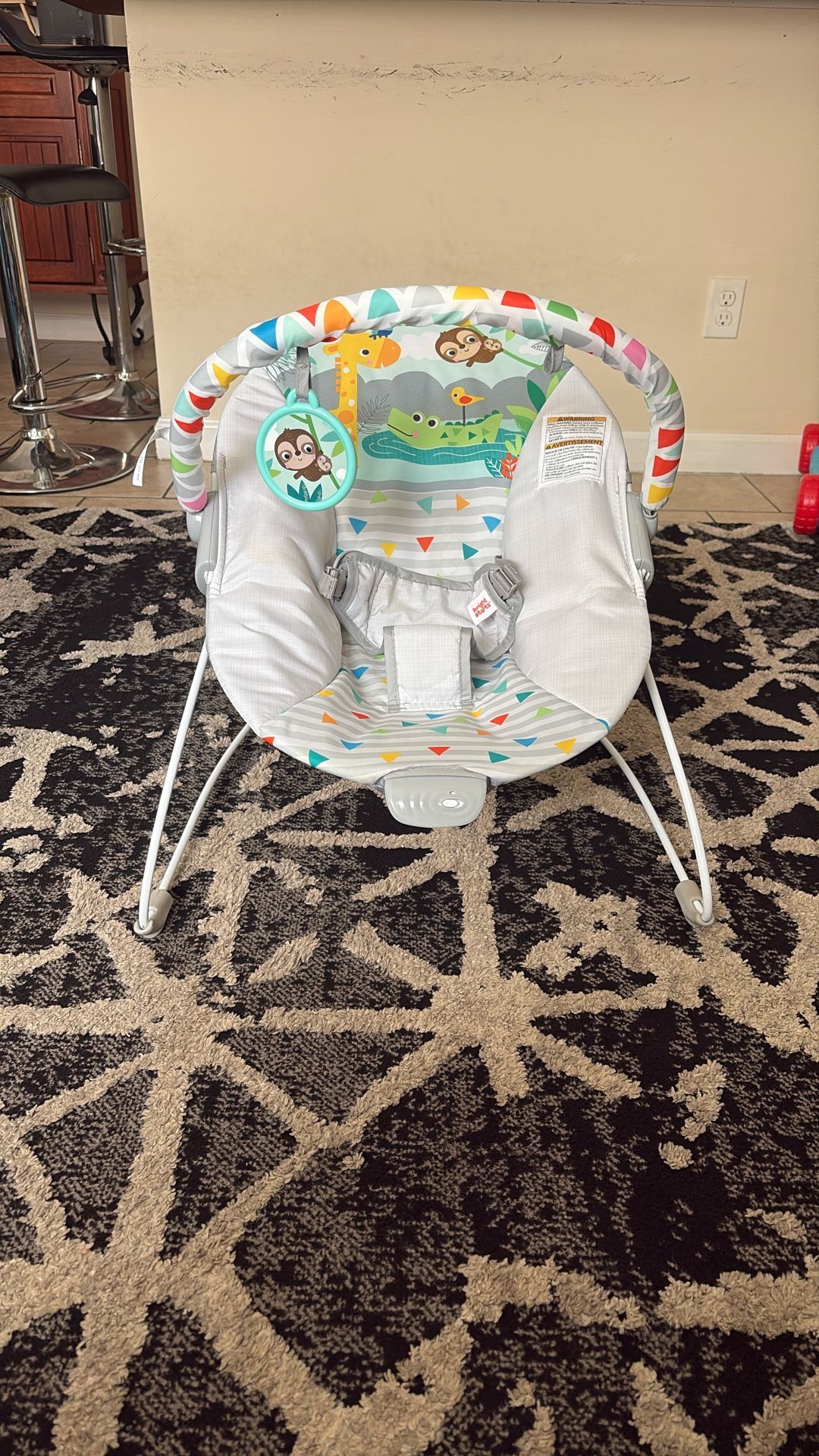 Bright Stars Vibrating Bouncer with Toy Bar- Safari Fun
