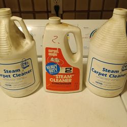 Three jugs of carpet cleaning solution