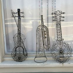Muy caliente; Three 1950s Spanish Gothic Scrolled Iron Musical Instruments