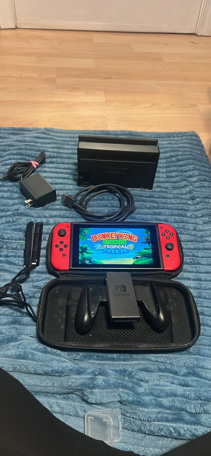 Nintendo switch with docking station, joycon grip case and donkey Kong tropical freeze game 