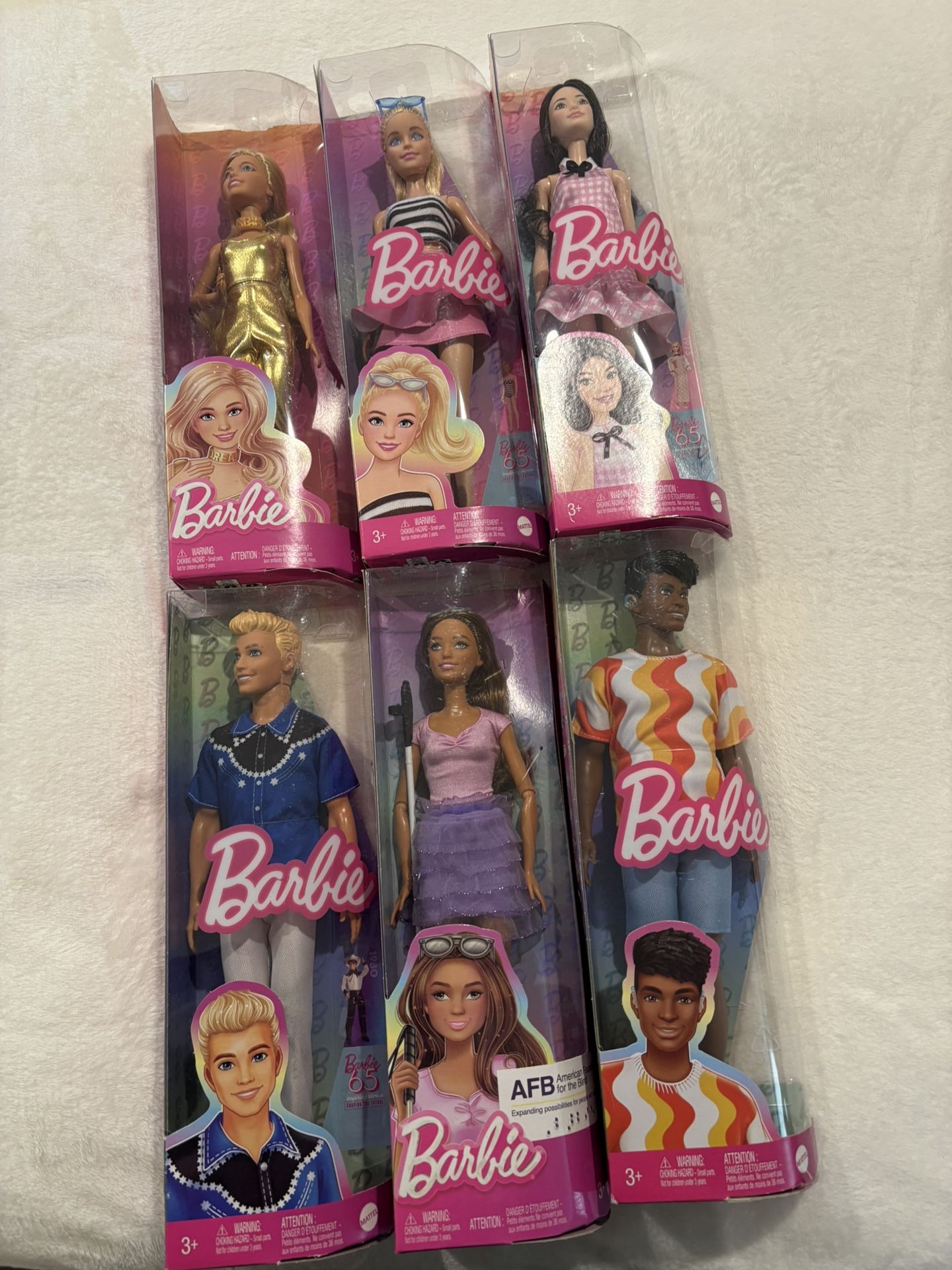 6 Barbie Dolls