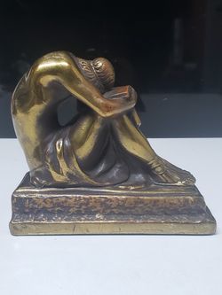 Solid bronze sleeping reader statuette