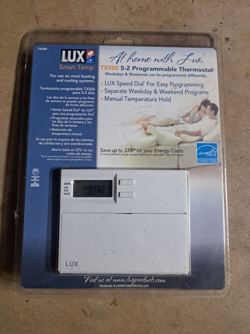 NEW. Programmable thermostat