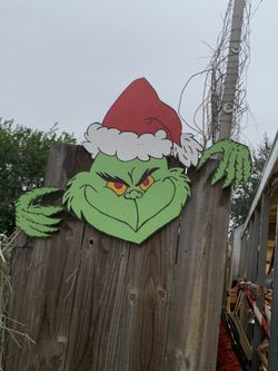 Christmas Grinch On Wood Fence 