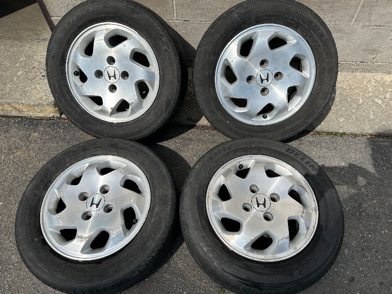 Four Honda Accord 15 inch aluminum wheels with old tires 4 on 4.5 lugs -T05918