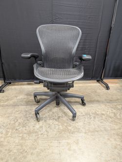 Black Mesh High-Back Herman Miller Office Chair with Headrest