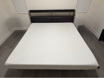 King bed mattress and frame setup