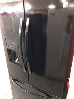 Used Kenmore black French door fridge. 1 year warranty