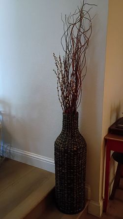 Wicker vase with dried branches