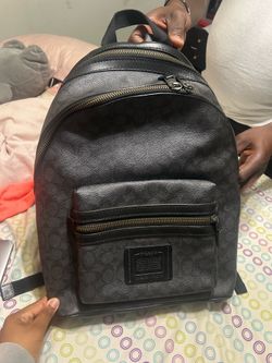 Black Coach backpack with adjustable straps