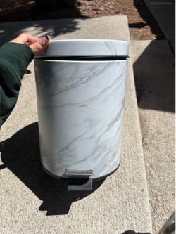 Small white trash can