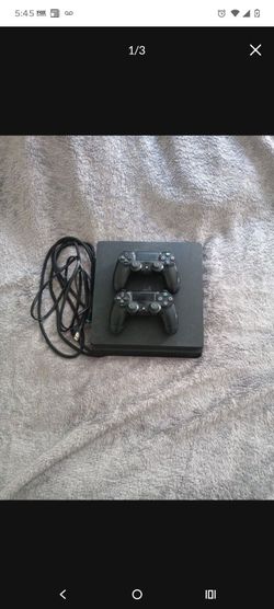 PlayStation 4 Slim Console with Two Controllers