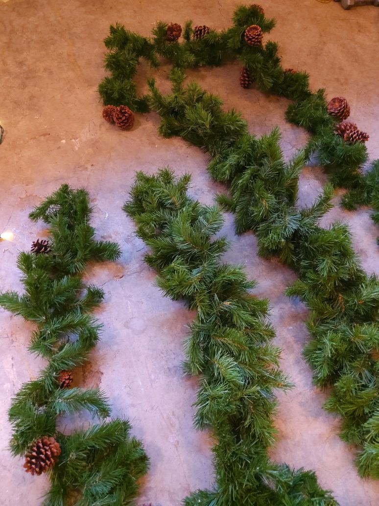 About 20' of garland and holiday boxes.
