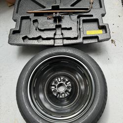 Spare Tire And Car Jack 