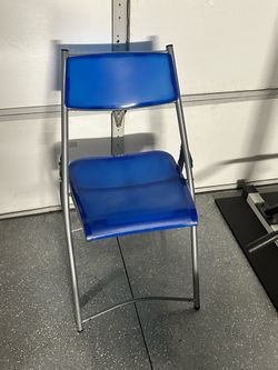 Blue plastic folding chair