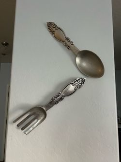 Kitchen or dining room decor. Big metal spoon and fork