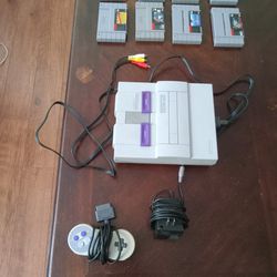 Snes With Games And Controller And Cords
