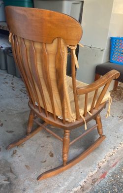 Antique rocking chair, cabinet, other chair.