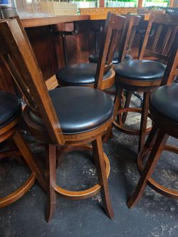 Wood and black leather barstools