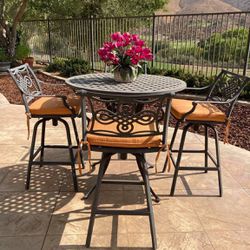 Wrought Iron Bar Height Table With 4 Swivel Chairs & 4 SunBrella Cushions.  