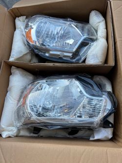 New 2015 Toyota Tacoma headlights fits 2012 to 2015 asking $175