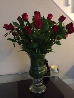 Flowers arrangements ,fresh red roses in a beautiful glass vase