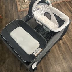 Pamo Babe 3-in-1 Playard with Bassinet & Changing Table – $60