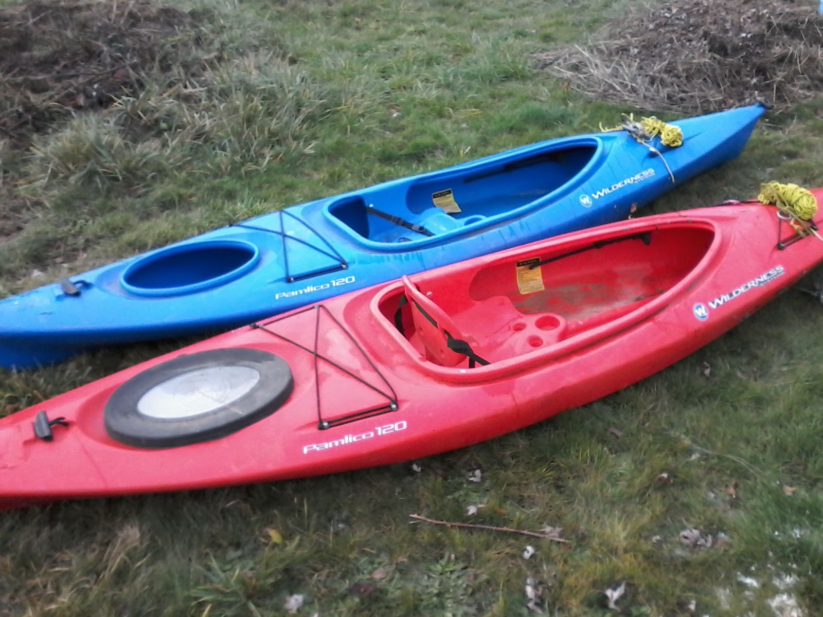 Wilderness Systems Pamlico 120 kayaks 1 blue and 1 red