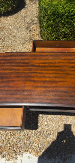Table with reverseable drawers