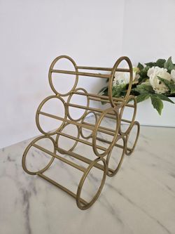 Golden metal wine holder