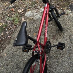 BMX Red mongoose bike with pegs front and back