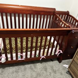 Baby crib with changing table