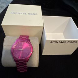 Michael Kors watch with a bold metallic pink finish 