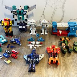 collection of vintage Transformers Generation 1 (G1) action figures.  Characters include: Transformers G1 Astrotrain (tall purple and white figure), T