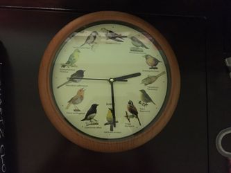 Wall clock sings birds