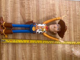 This a fully plastic poseable disney pixar Toy Story sheriff woody
