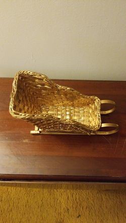 Gold Christmas basket shaped like a sleigh