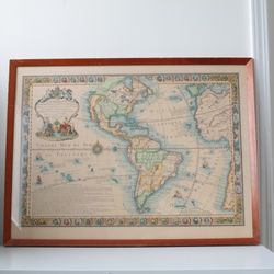 Framed 1731 “L'Amerique Meridionale et Septentrionale” antique map
