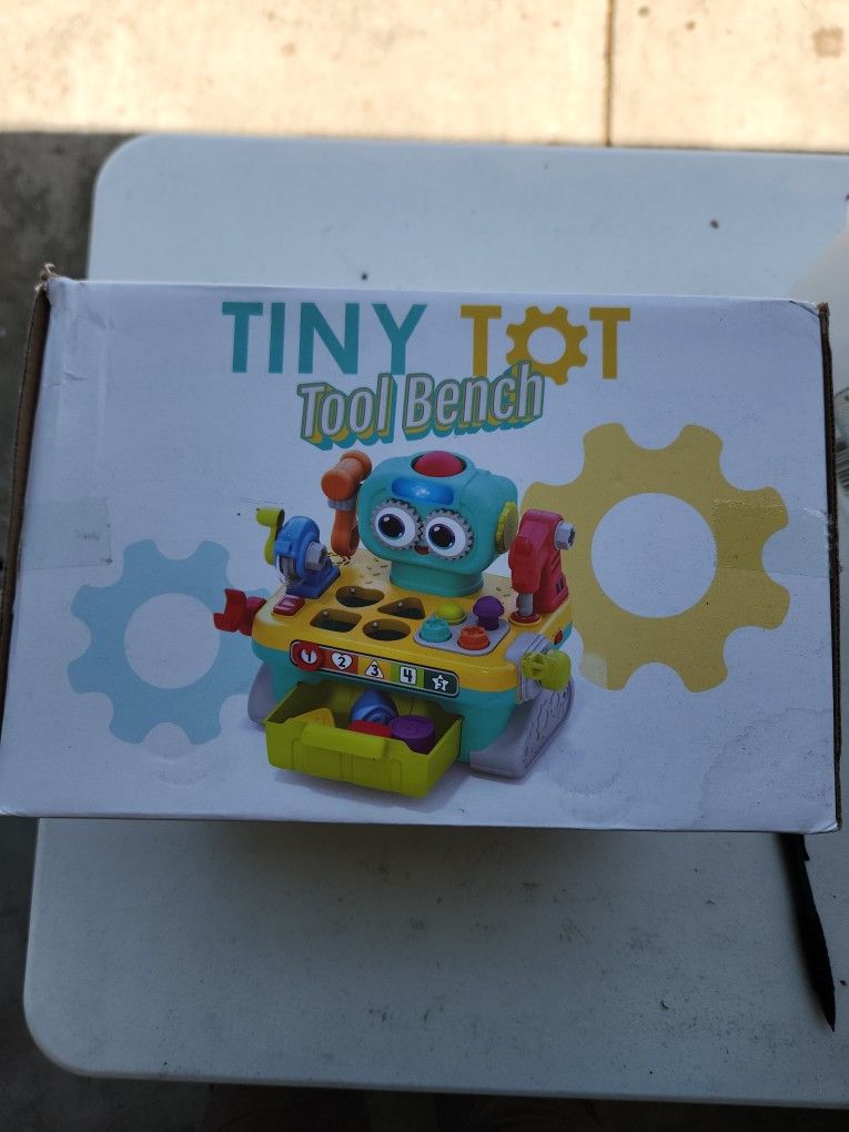 Play and learn tiny tot to a bench.