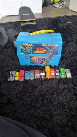 Vintage Atari box and a bunch of vintage cars