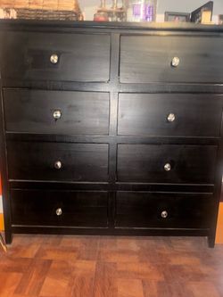 Black stained wood 8 drawer dresser