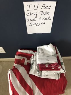Twin bedding IU set- two sets included- small rip in the corner of one of the comforter that can easily be sewn up