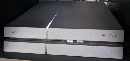 PS4, DualShock Controllers w/Charging Base and Games