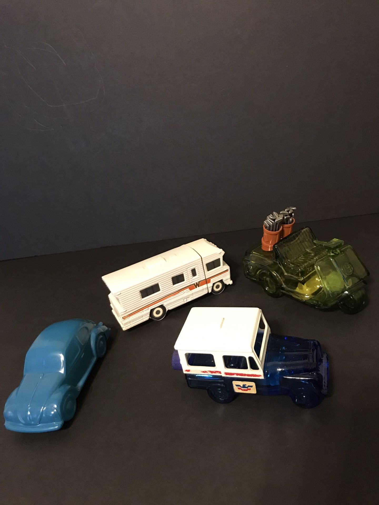 Set of 4 Vintage Avon Vehicles- VW Bug, Winnebago RV, Mail Truck, & Golf Cart