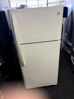 Kenmore white apartment size refrigerator and top freezer