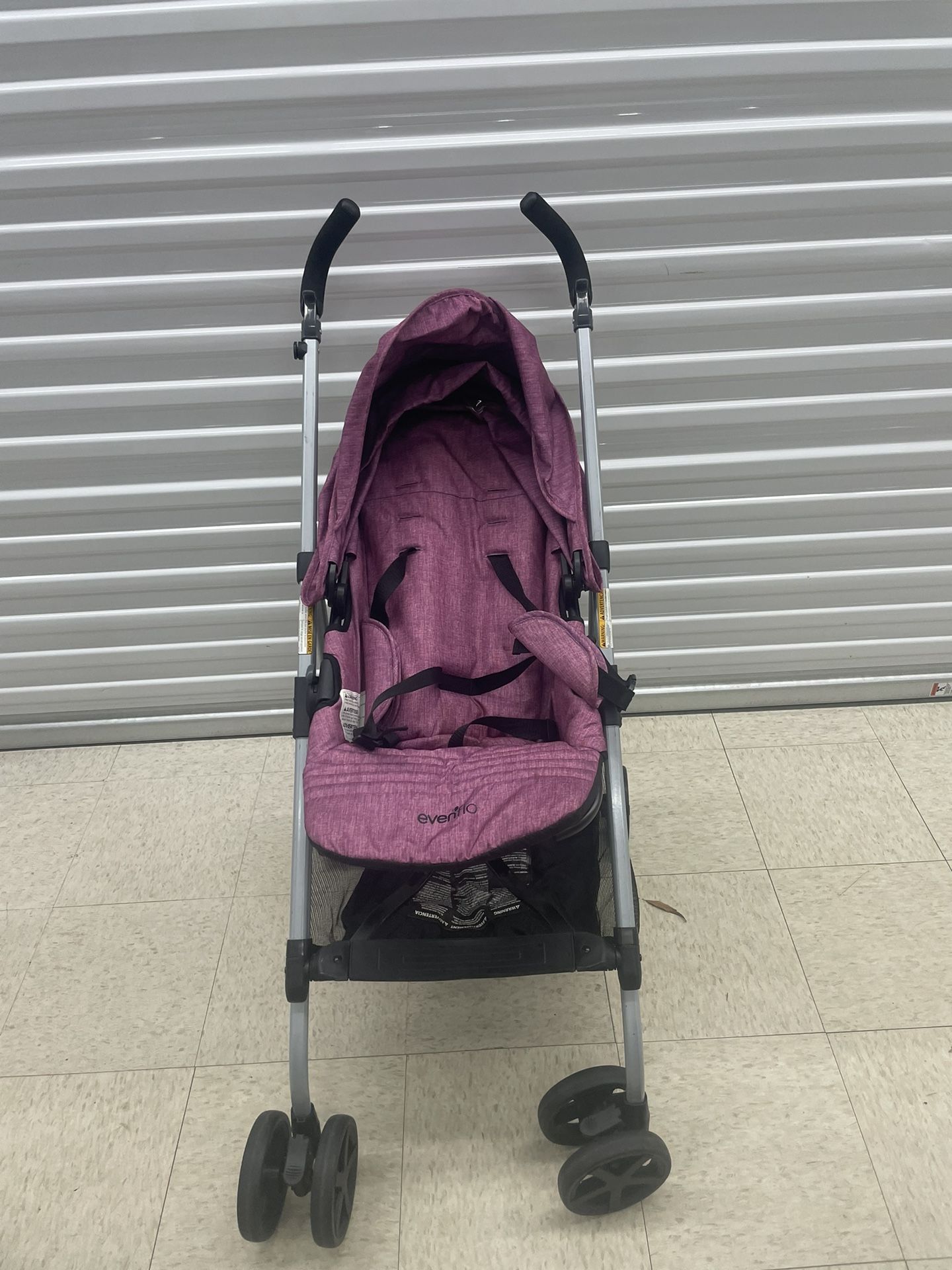 PURPLE EVENFLO BABY STROLLER