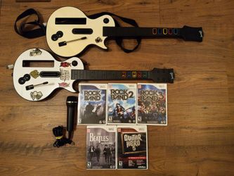 2 Nintendo Wii Guitar Hero Controllers microphone and 5 games