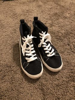 Black high top sneakers.