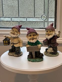 Three bobble head gnomes